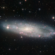 Illustration for article titled This cloud-shrouded galaxy is a million light years closer to us than we thought